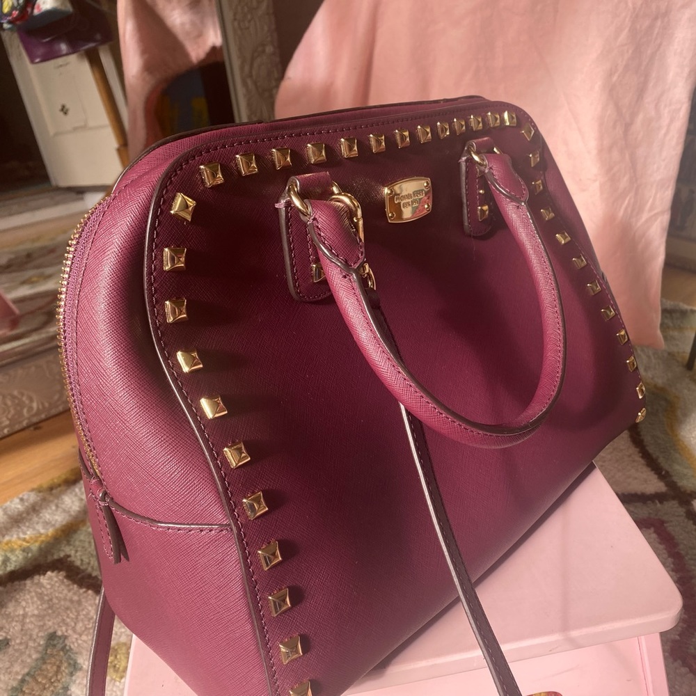 Michael Kors burgundy tote with Gold detail.